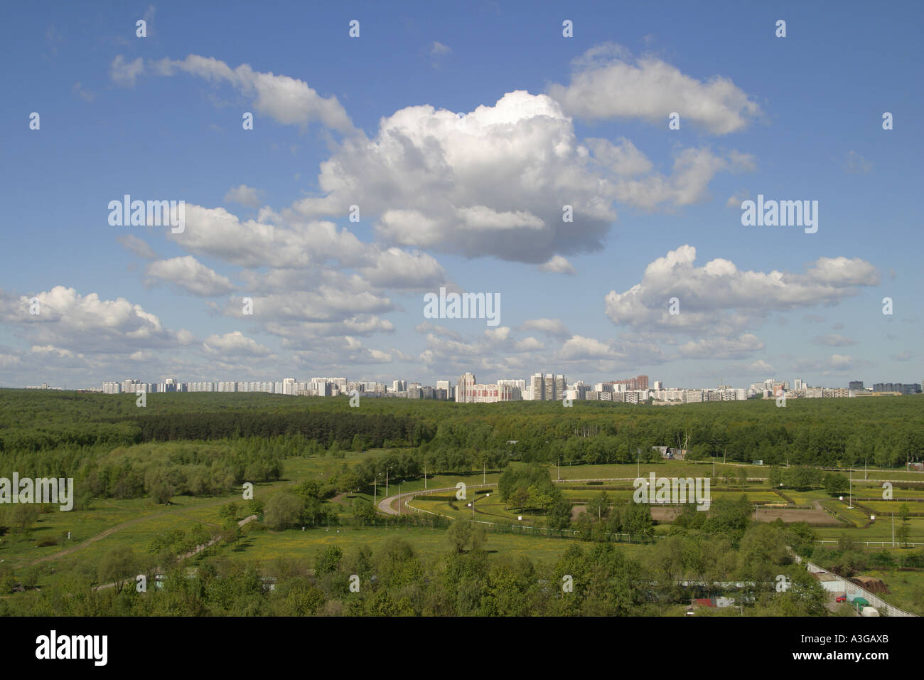 Clouds, park and city Stock Photo - Alamy