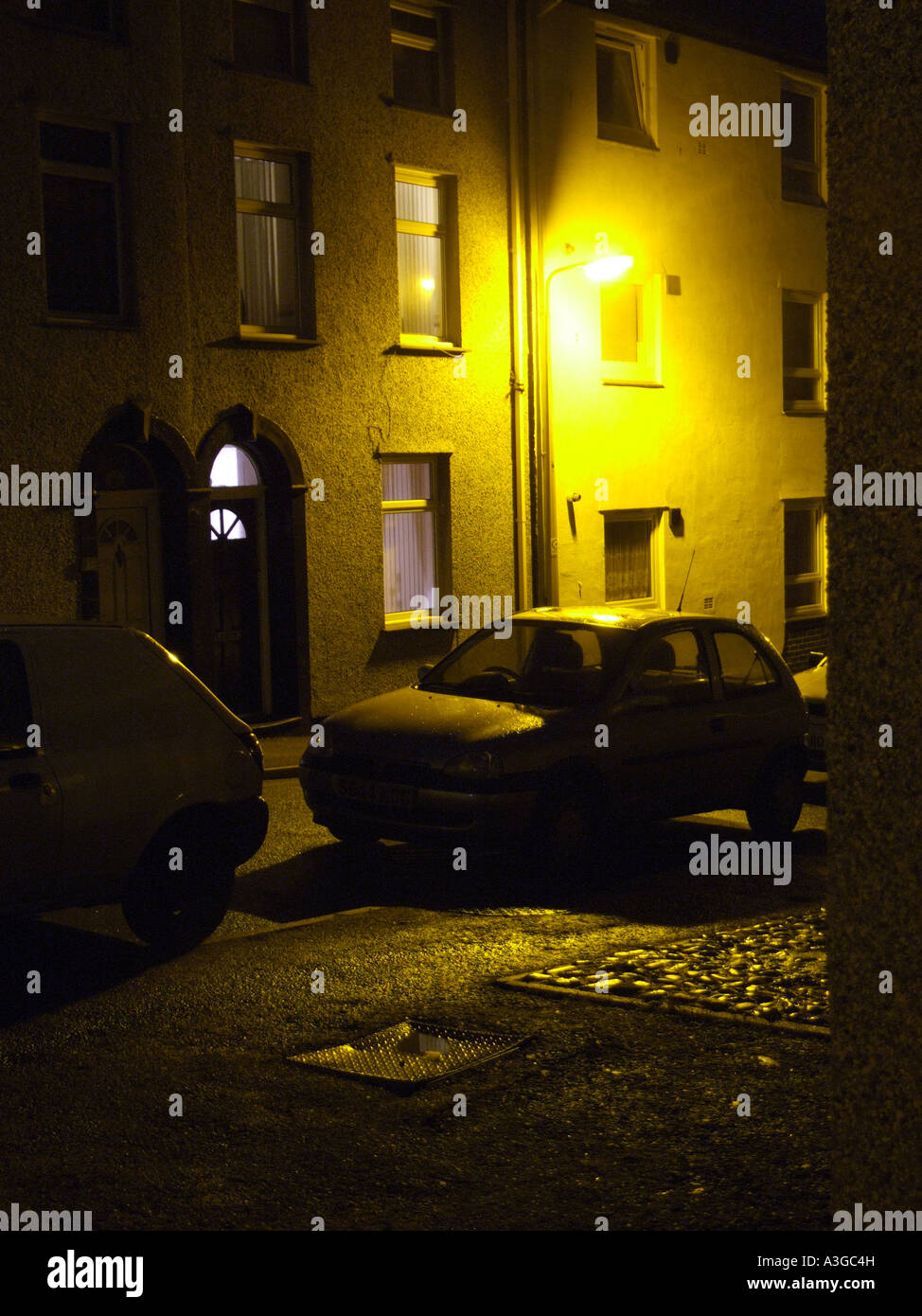 car parked outside house night Stock Photo Alamy