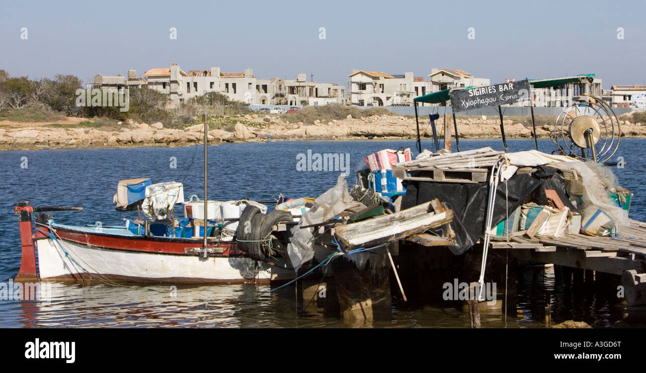 Ongoing development in Cyprus overpowers an old fishing harbor Stock Photo