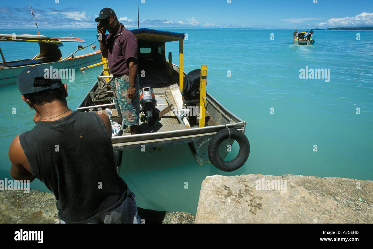 Double hulled fishing boats transport people from Upolu to Manono