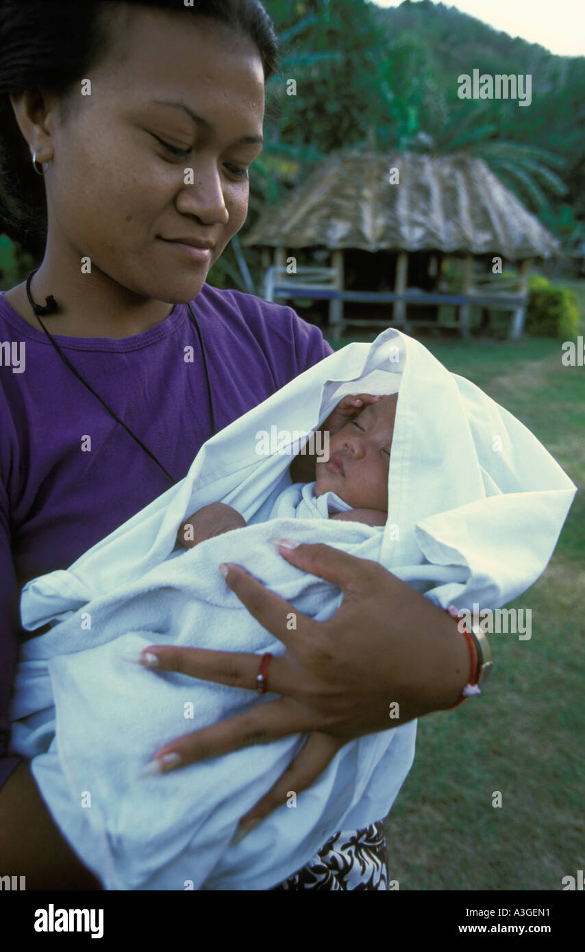 A young woman with a small baby on the island of Apolima Samoa Stock Photo  - Alamy