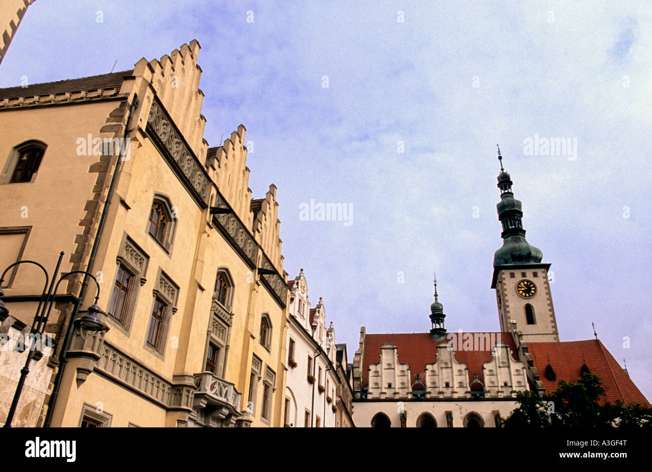 16th century Town Hall w bell tower of Dekansky kostel rising over Zizkovo Namest Central Square Tabor Czech Republic Stock Photo