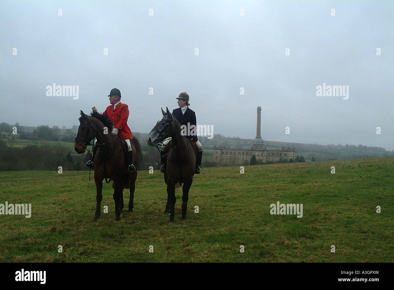 Heythrop Hunt members at Traditional Boxing Day Meet, Chipping Norton, Oxfordshire, with former Bliss Mill to rear Stock Photo
