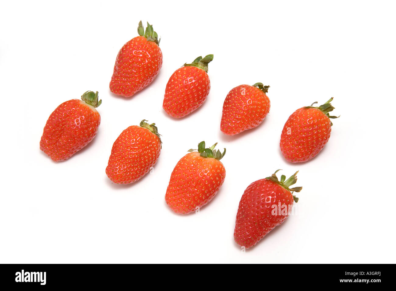 Strawberries isolated on a white studio background Stock Photo - Alamy