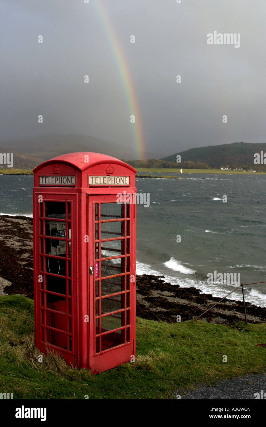 Red telephone box and rainbow on the Isle of Lismore Scotland Stock