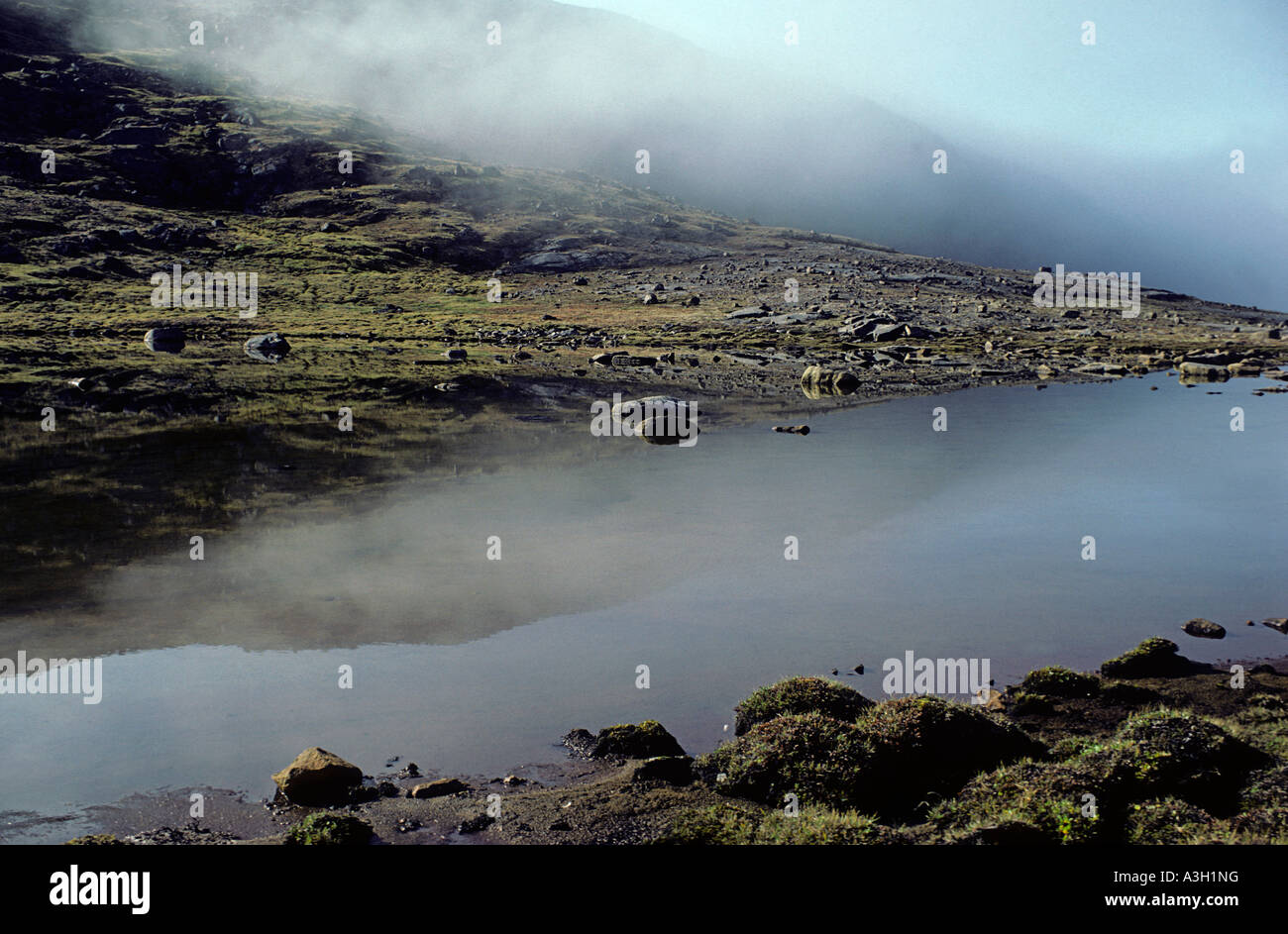 Tundra pond and mist South Baffin Island Northwest Territory Canada Stock Photo