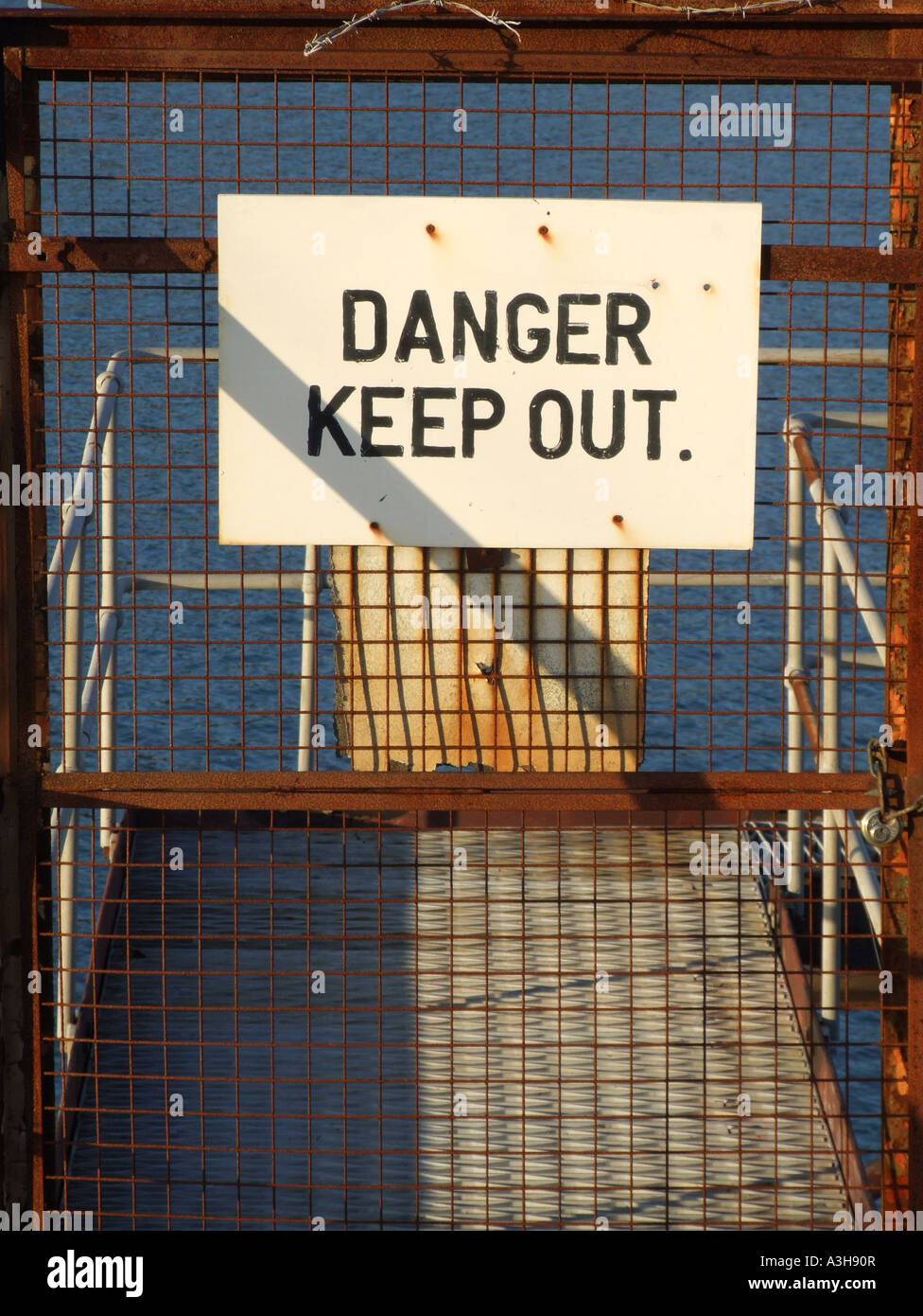 danger keep out sign by jetty Stock Photo