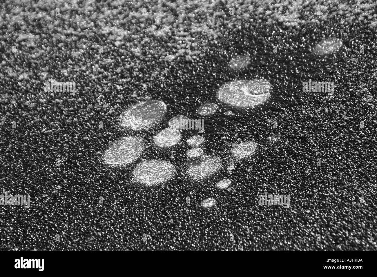 Air bubbles beneath Ice on River Aare near Berne Switzerland Stock Photo