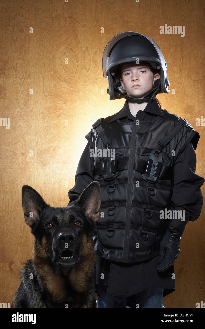 Girl Dressed as Policewoman with Police Dog Stock Photo