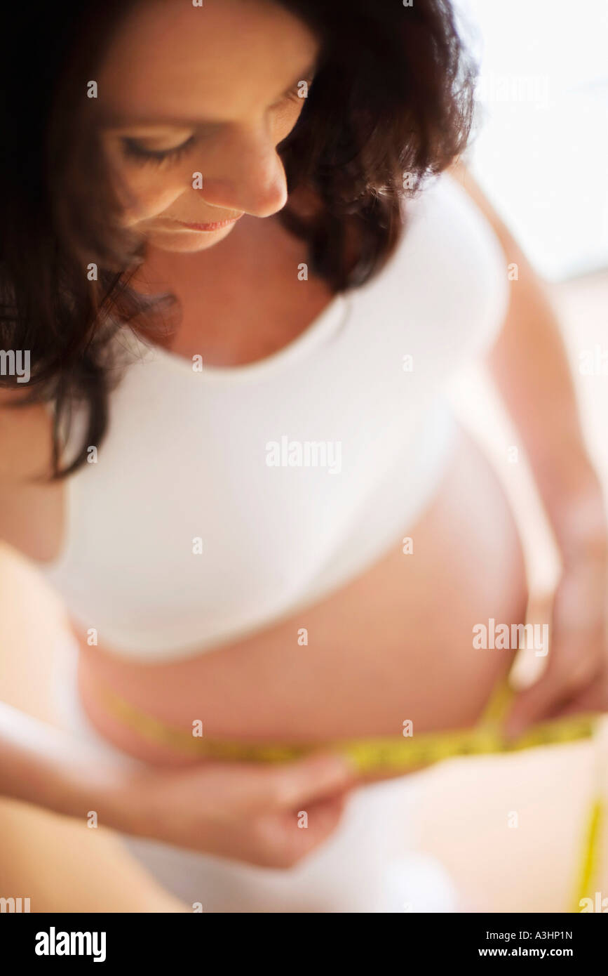 Pregnant Woman Measuring Belly Stock Photo