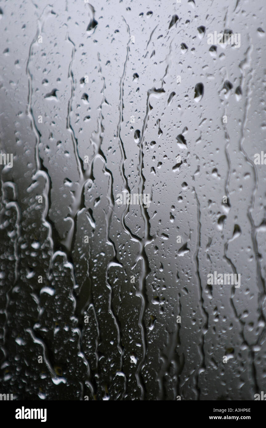 Rain drops running down a glass window Stock Photo