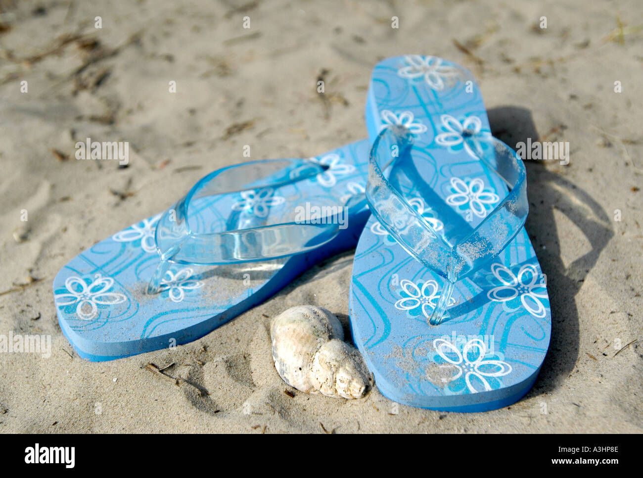 flip flops on a sandy beach Stock Photo - Alamy