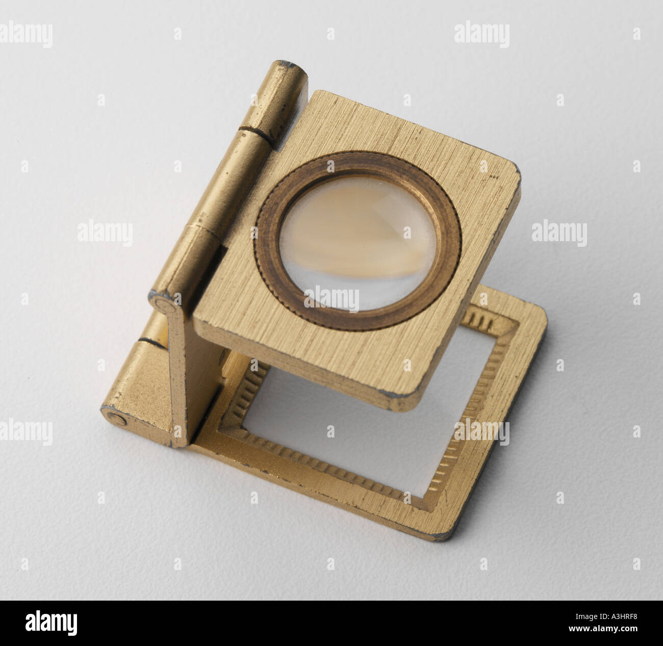 glass magnifying gold Stock Photo Alamy