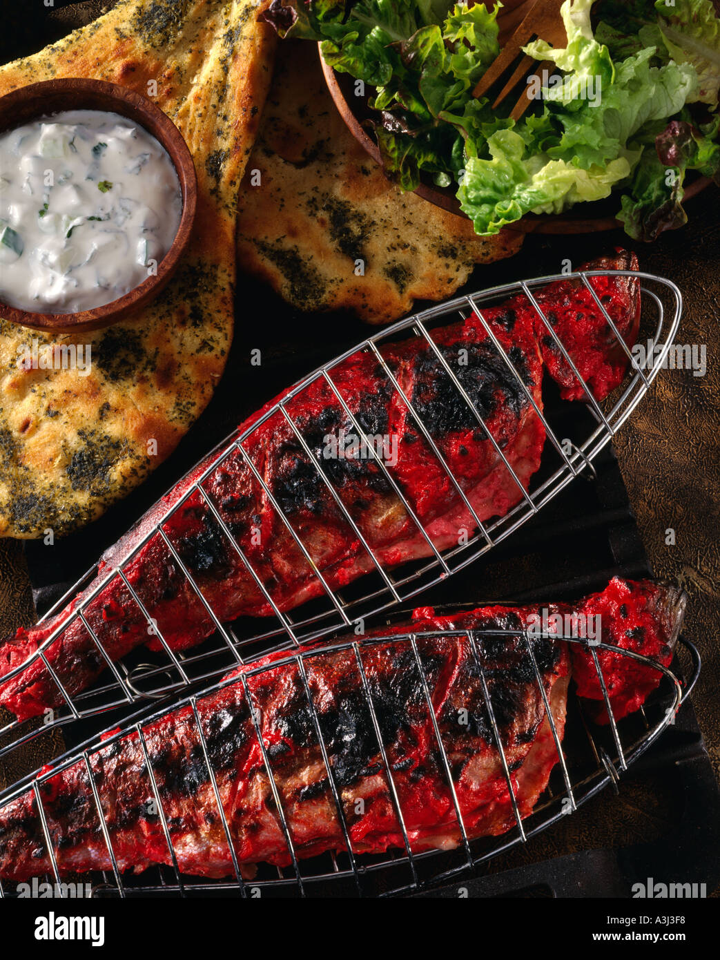 Indian food Barbecued tandoori fish with spiced naan bread Stock Photo ...