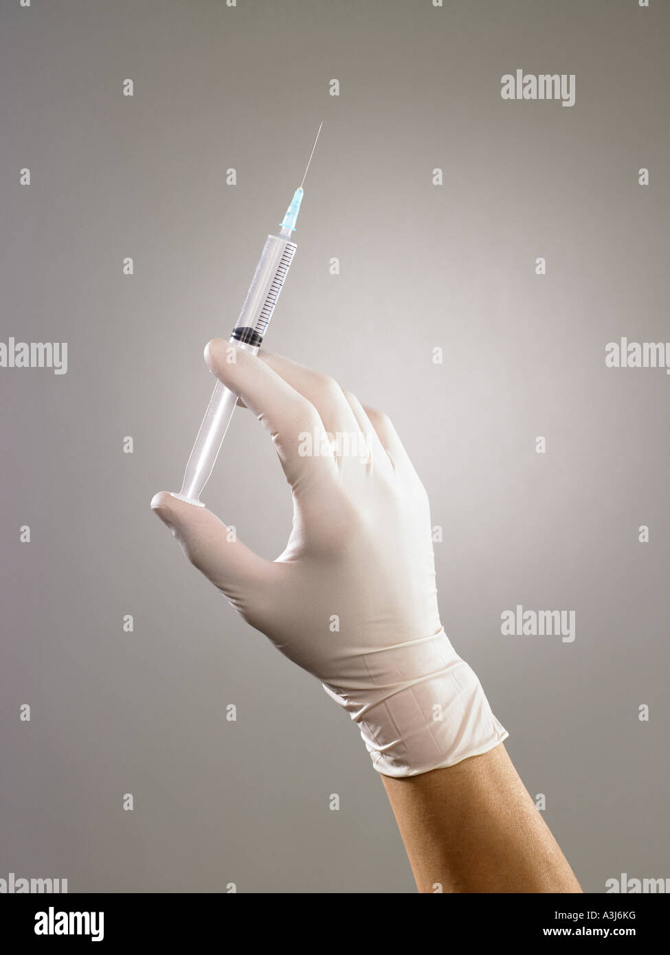 Person holding syringe Stock Photo Alamy