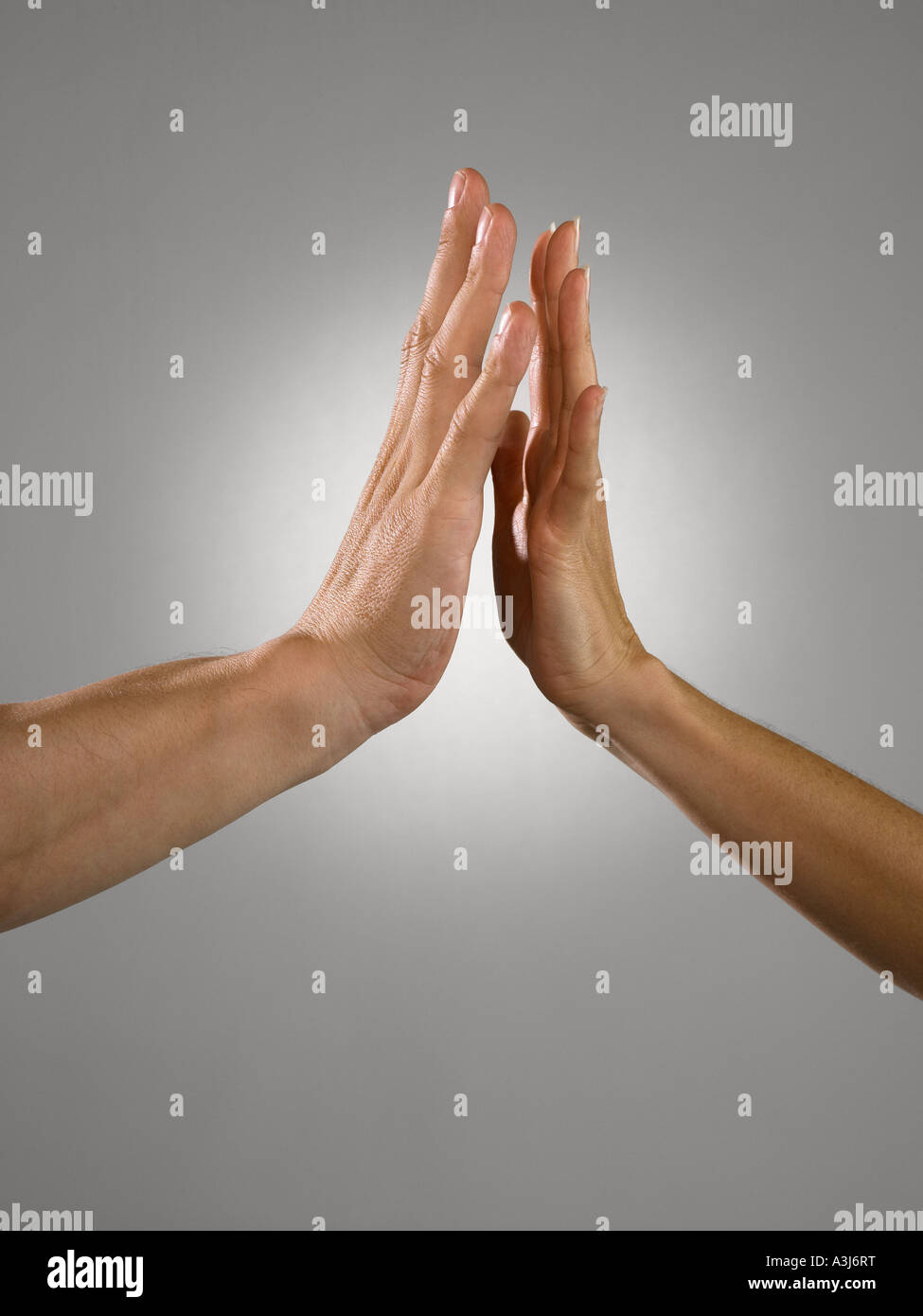 Man and woman with palms facing Stock Photo Alamy