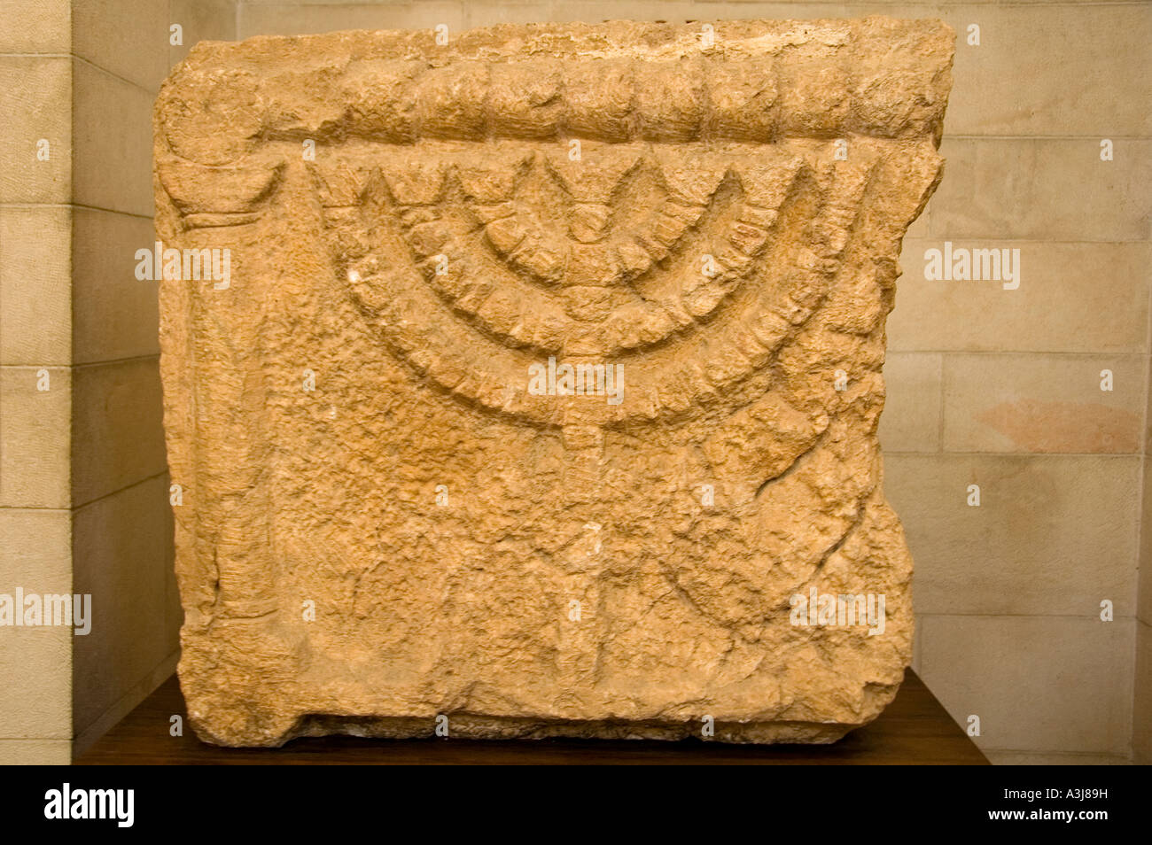 Stone relief bearing a carved figure of the Jewish Seven-Branched Menorah from 3rd-4th century CE at the Rockefeller museum East Jerusalem Israel Stock Photo