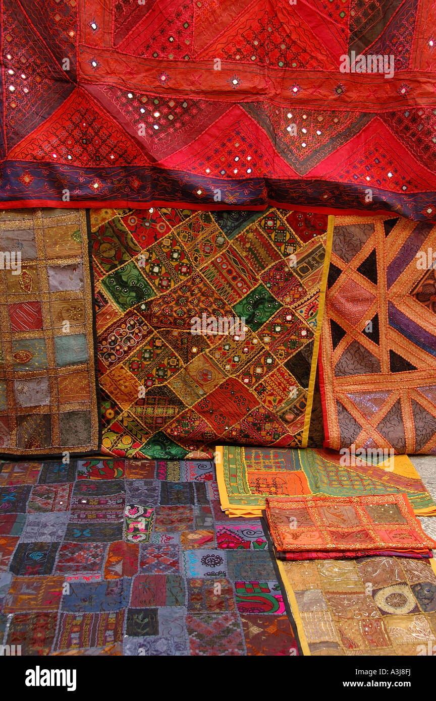 Richly coloured Palestinian fabric for sale the old city market in East Jerusalem Israel Stock Photo