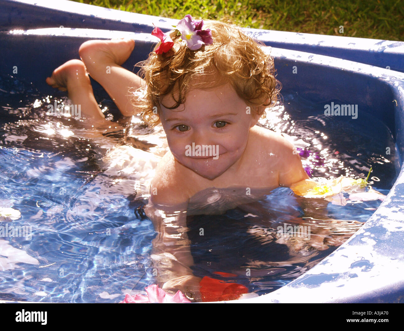 little girl swimming in wading pool Stock Photo Alamy