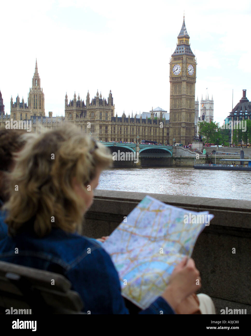 tourist checking London map in front of Big Ben Stock Photo Alamy