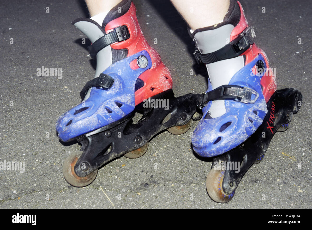 Young girl s feet in a pair of rollerblades Stock Photo Alamy