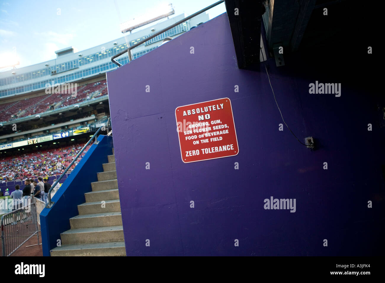 A sign indicates rules of behaviour on a wall of the tunnel to the