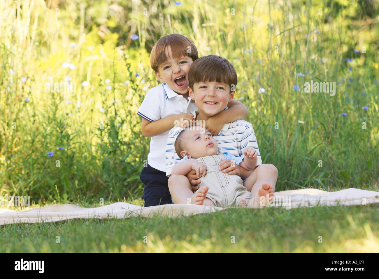 Portrait of Three Brothers Outdoors Stock Photo
