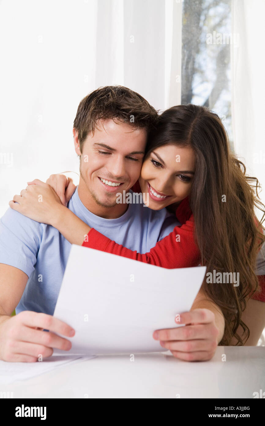 Couple Looking at Document Stock Photo