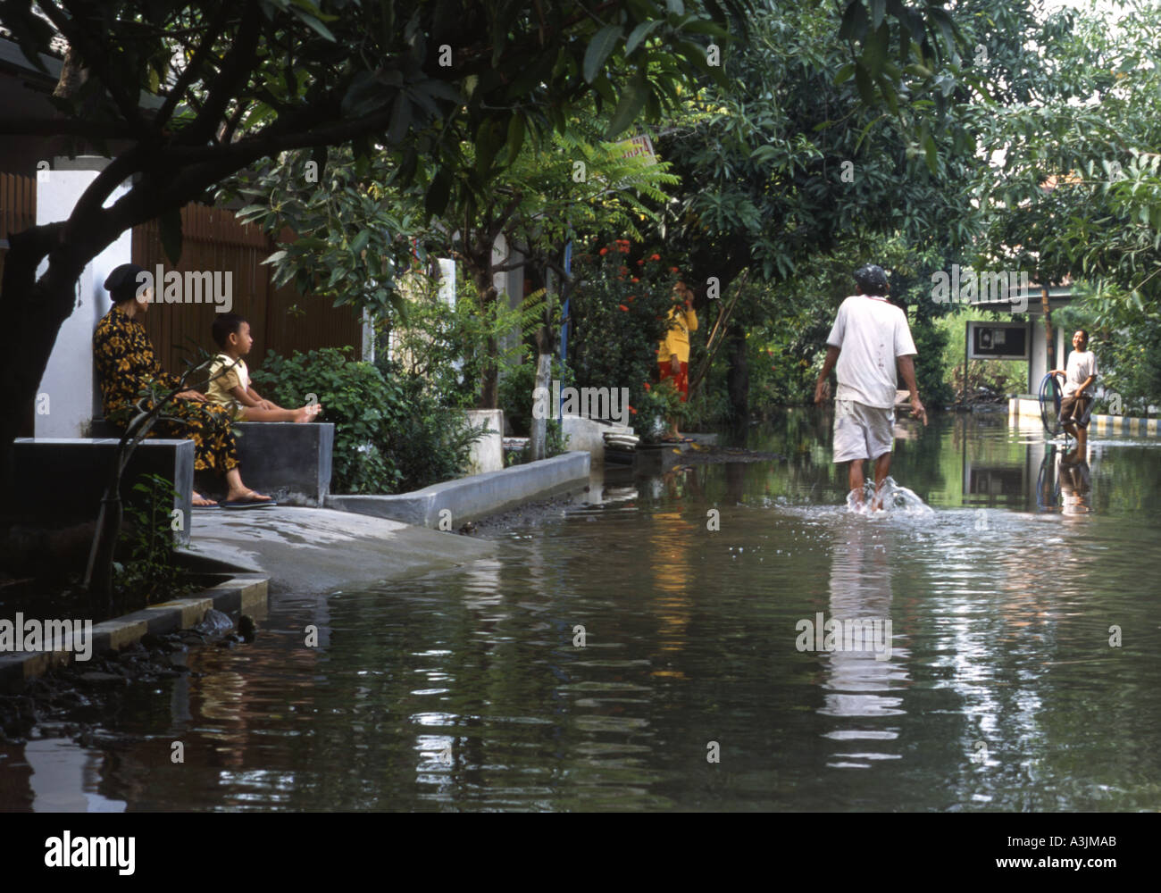 flooded streets after heavy monsoon rains trosobo near surabaya java indonesia Stock Photo