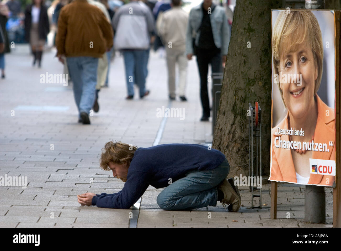 Beggar begs in the street in Hamburg, Germany Stock Photo