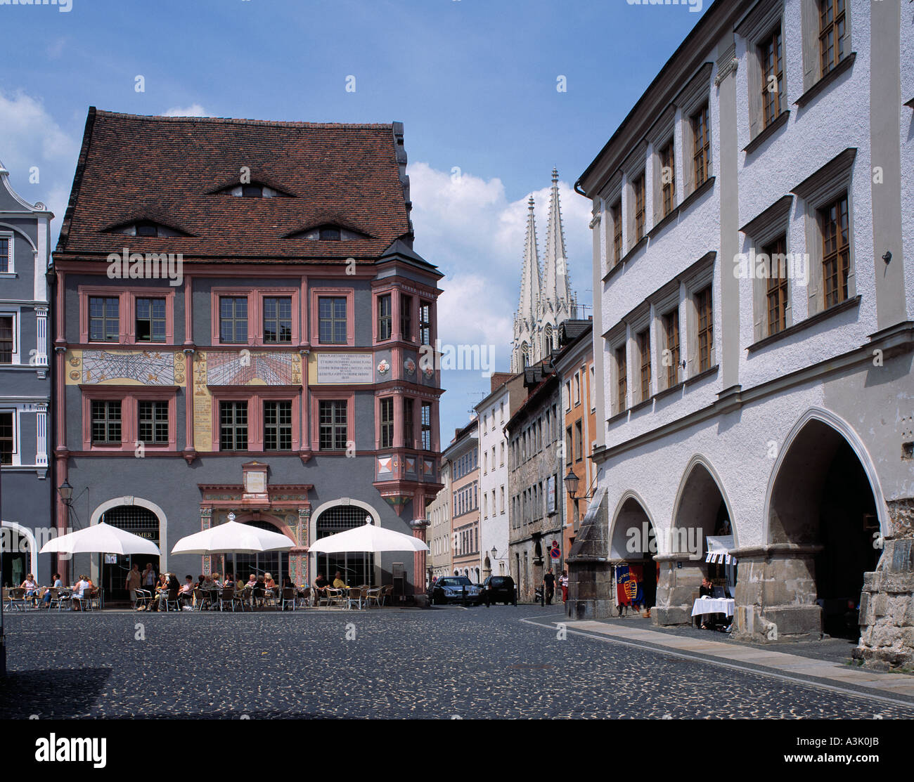 Ratsapotheke und Lange Laeuben am Untermarkt in Goerlitz, im Hintergrund Tuerme der Kirche St. Peter und Paul Stock Photo