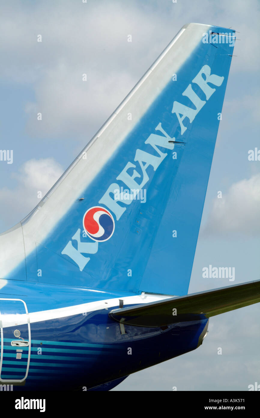 Korean Air logo on tail of Boeing 737 900 twinjet aircaft Stock