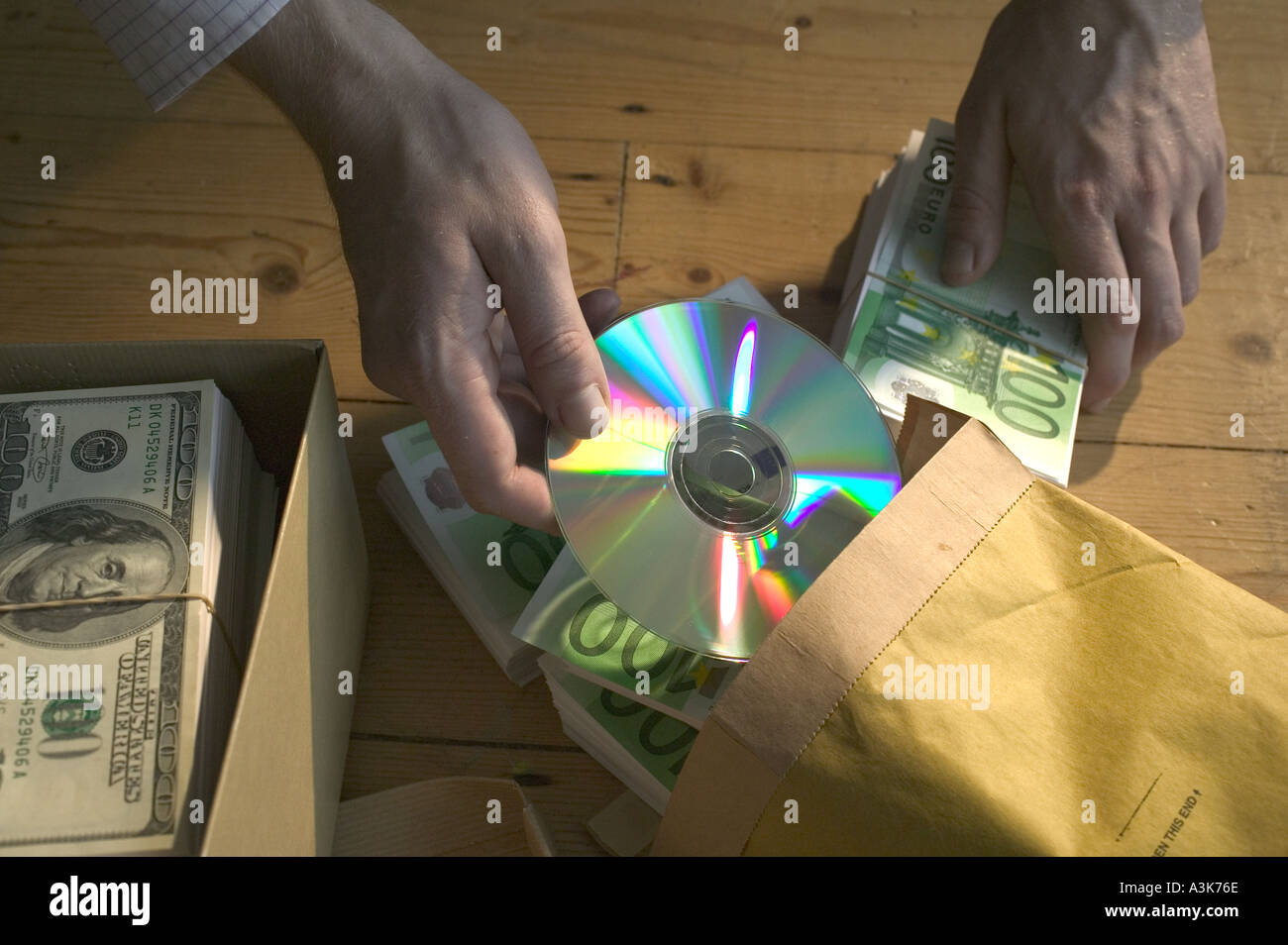 Shoebox of dollar bills and man with package of euro banknotes Stock ...