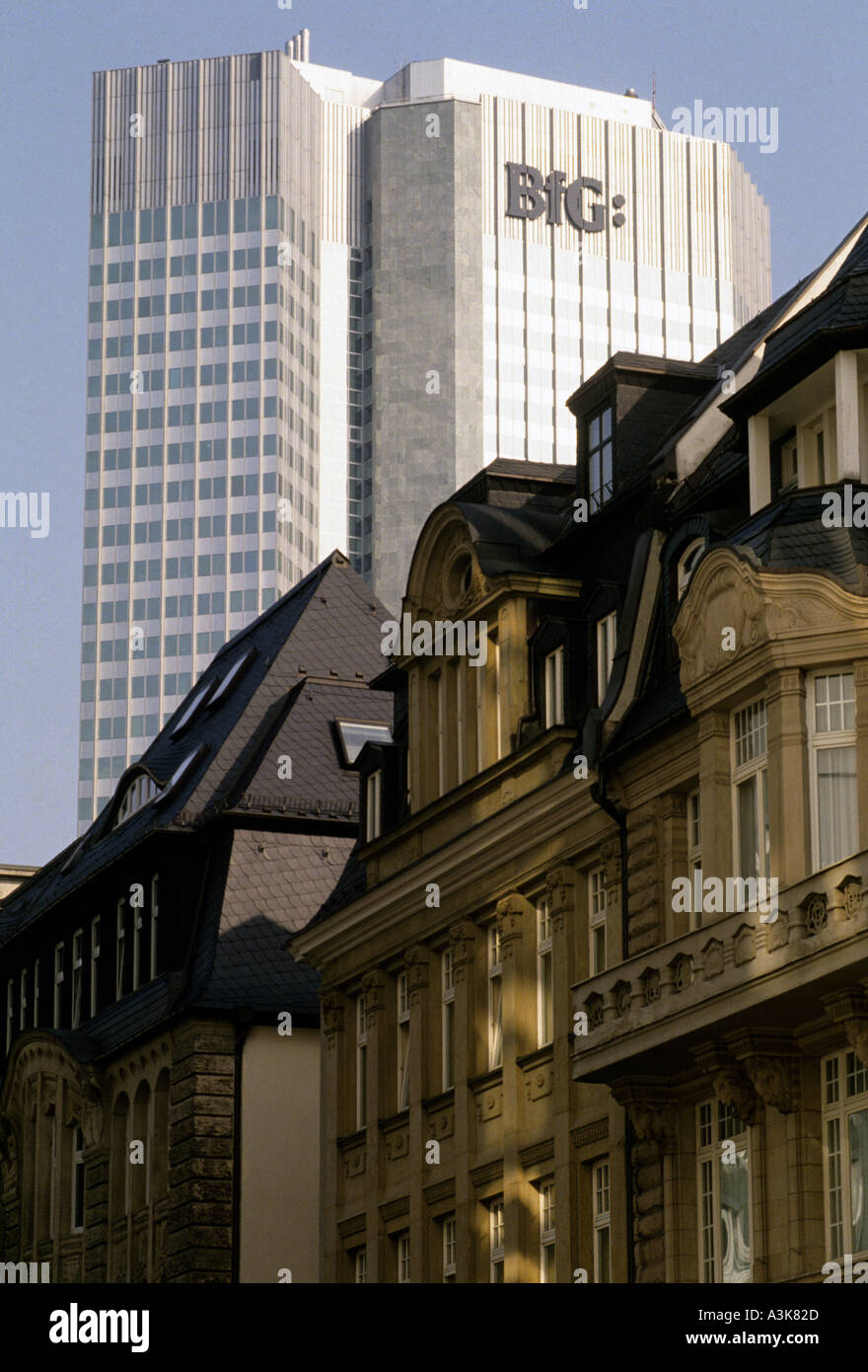 The headquarters of the BfG Bank tower over old buildings in the financial district of Frankfurt Germany Stock Photo