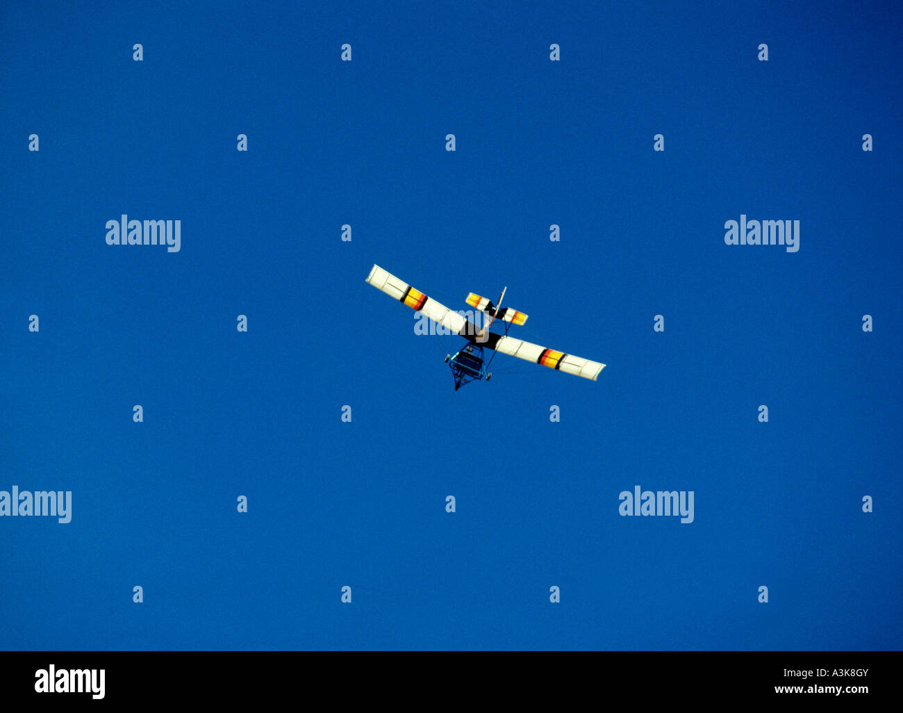 Microlite lightweight single engine aircraft against a blue sky Stock Photo