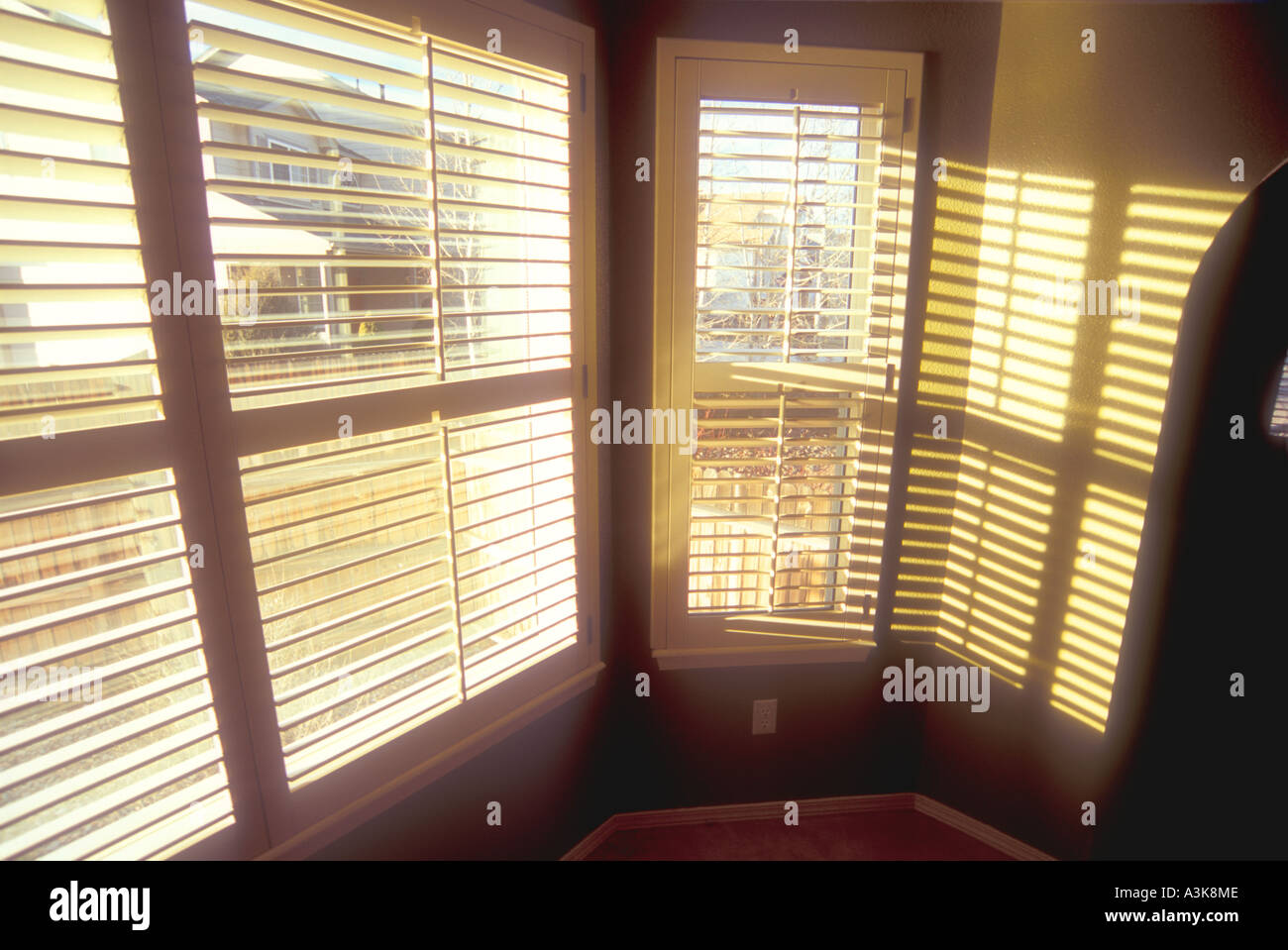 Windows In House With Wooden Plantation Shutters Stock Photo