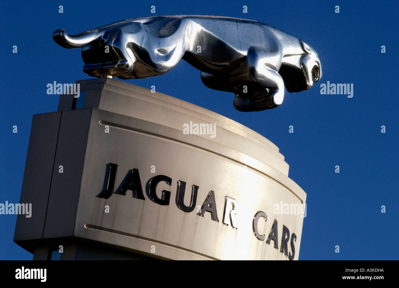 The Jaguar car symbol The Leaper on a plinth above the Browns Lane plant in Coventry Warwickshire Stock Photo