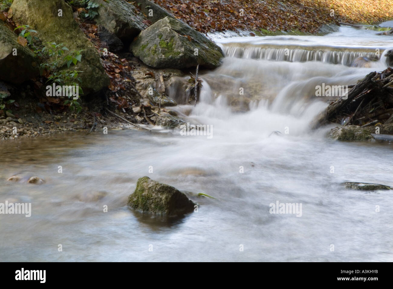 Water flowing through rocks Stock Photo