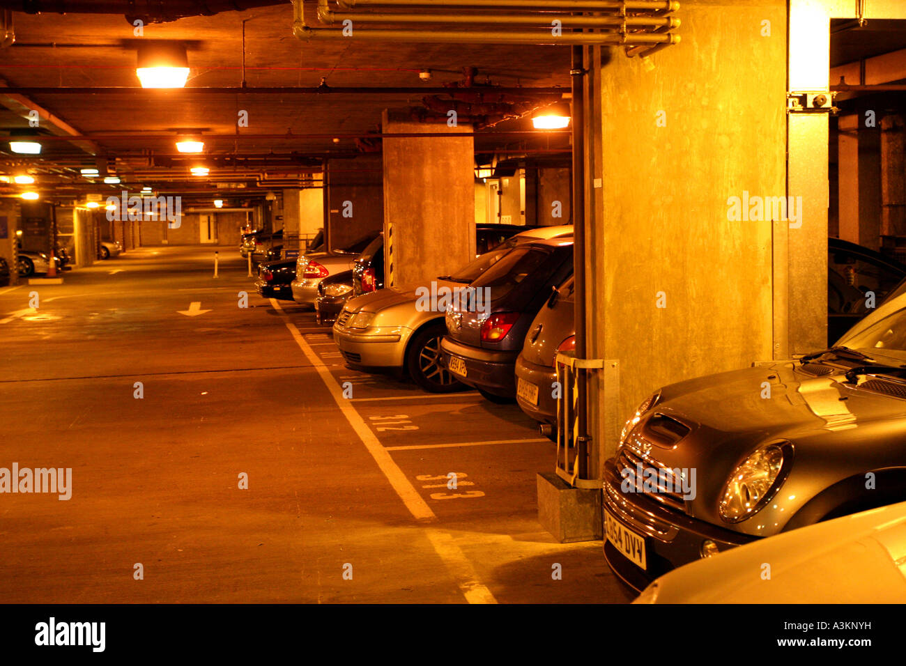 Underground lit car park in Central London Stock Photo - Alamy