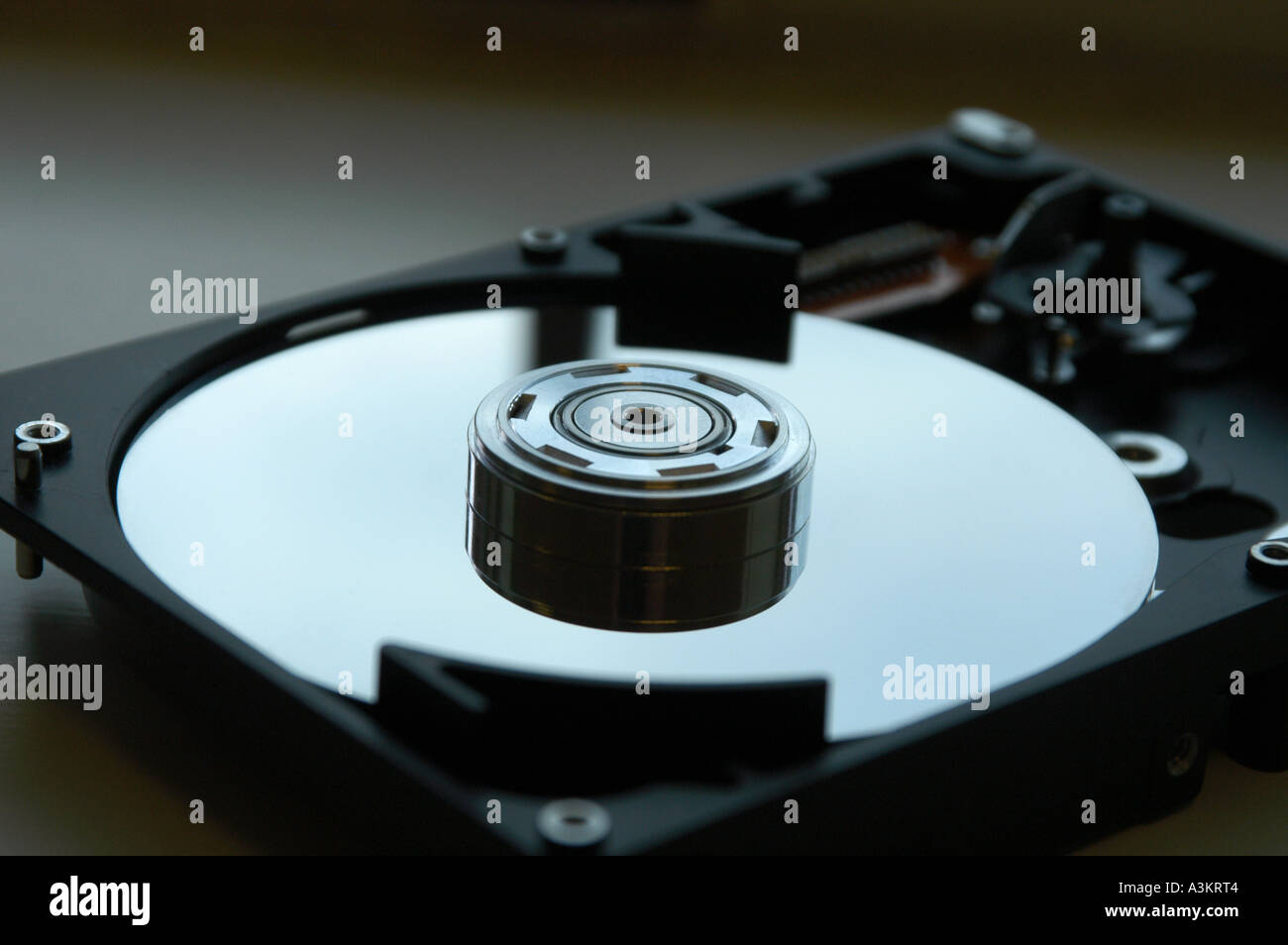 A computer hard disk drive opened revealing the platters Stock Photo