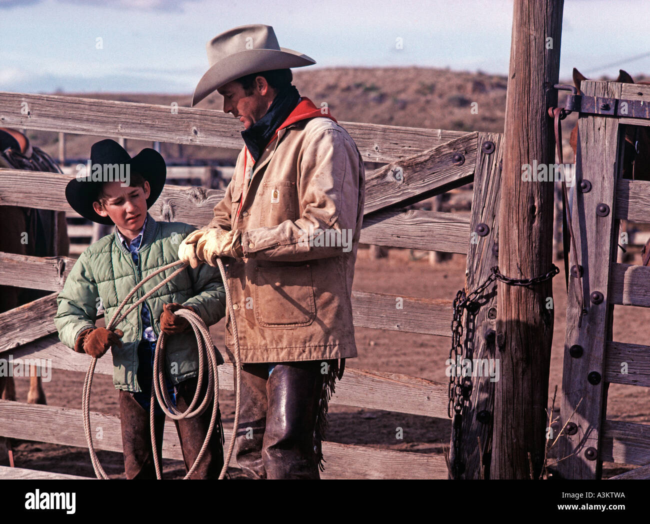 Father and son cowboys on ranch Amarillo TX USA Stock Photo