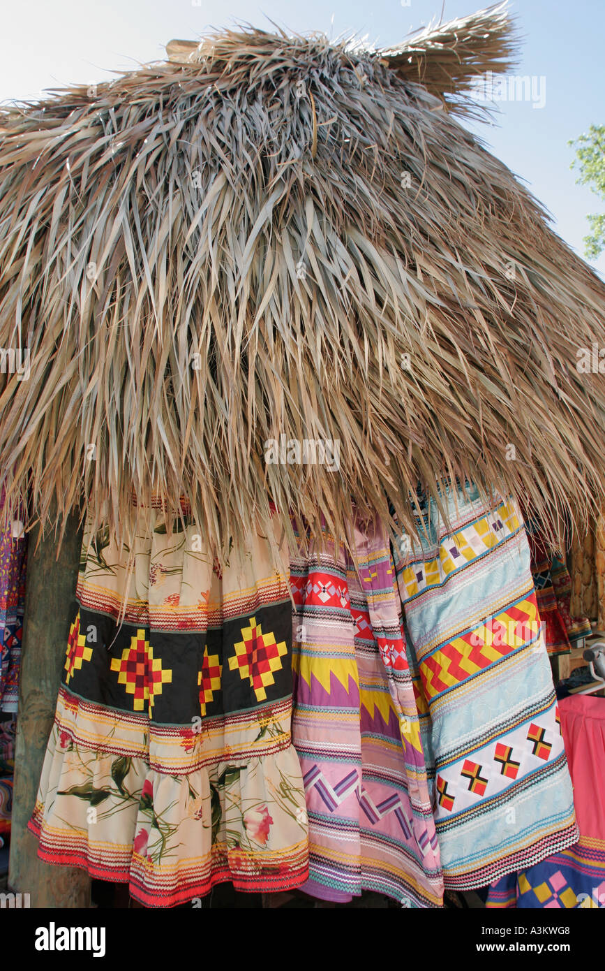 Miami Florida,Everglades,Miccosukee Seminole Tribe Arts Festival,festivals,celebration,fair,reservation,Native patchwork dresses,thatched hut,roof,vis Stock Photo