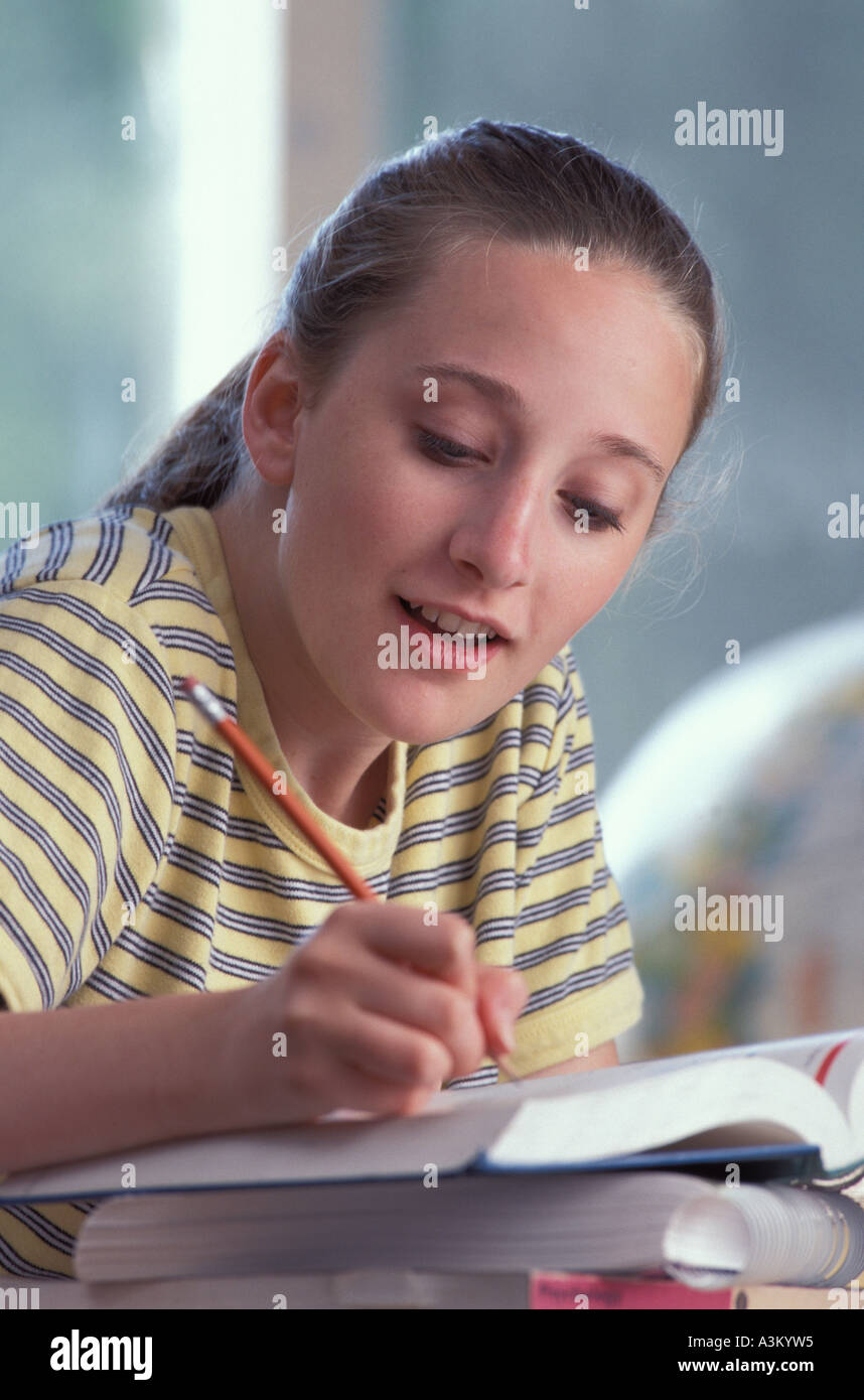 teenage girl studying at her desk in school Stock Photo - Alamy