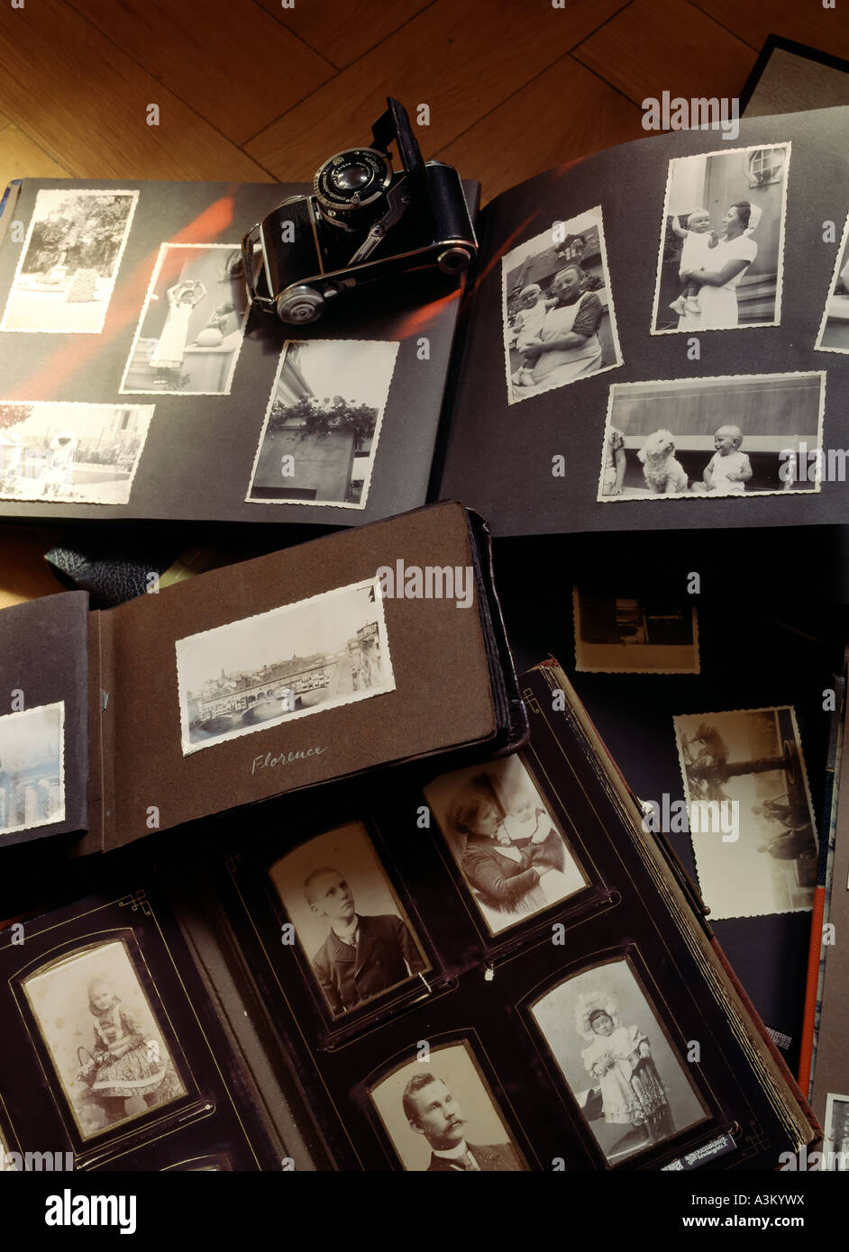 Ancient picture albums with family portraits, travel and baby photos Stock Photo