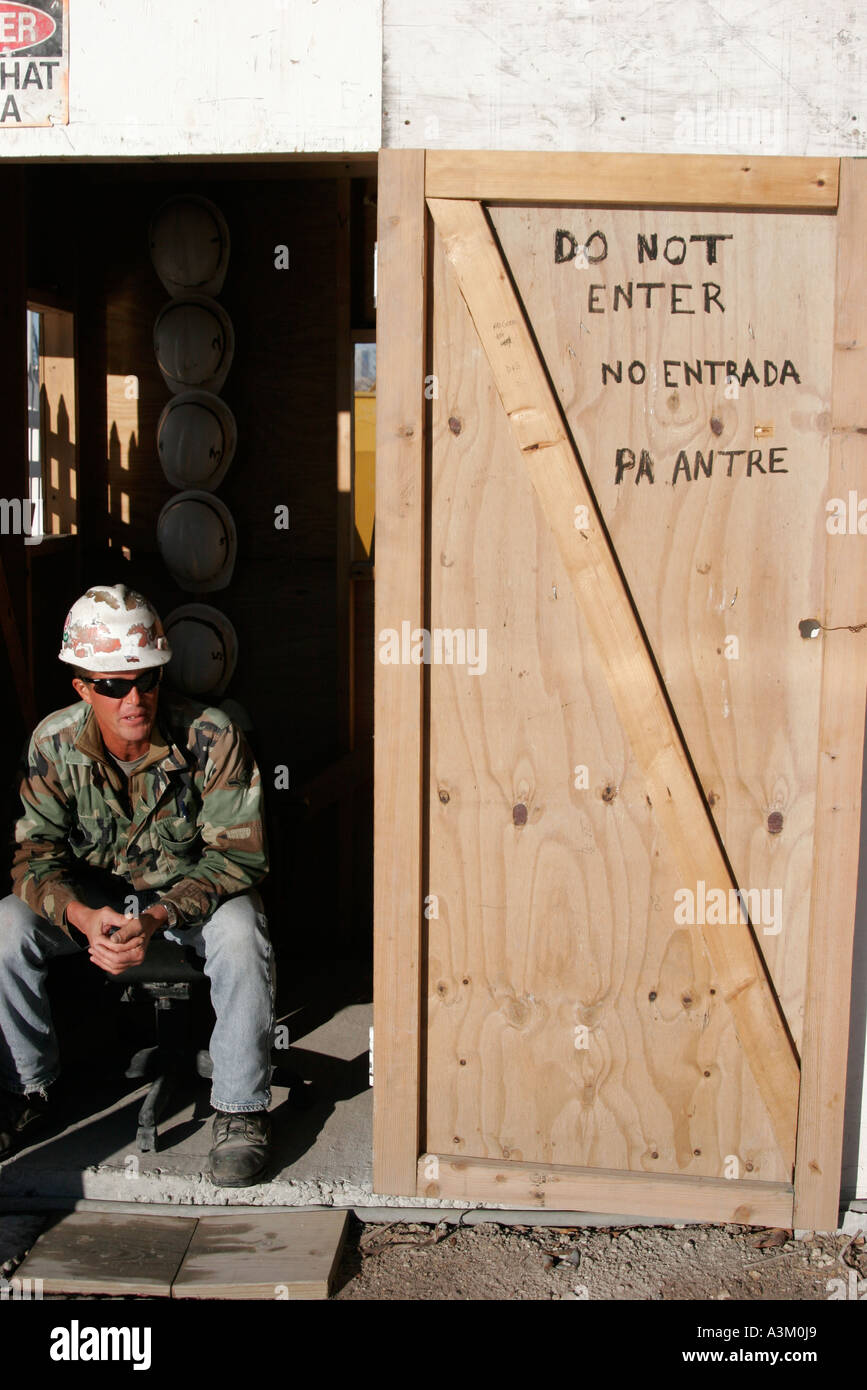 Miami Beach Florida,under new construction site building builder,worker