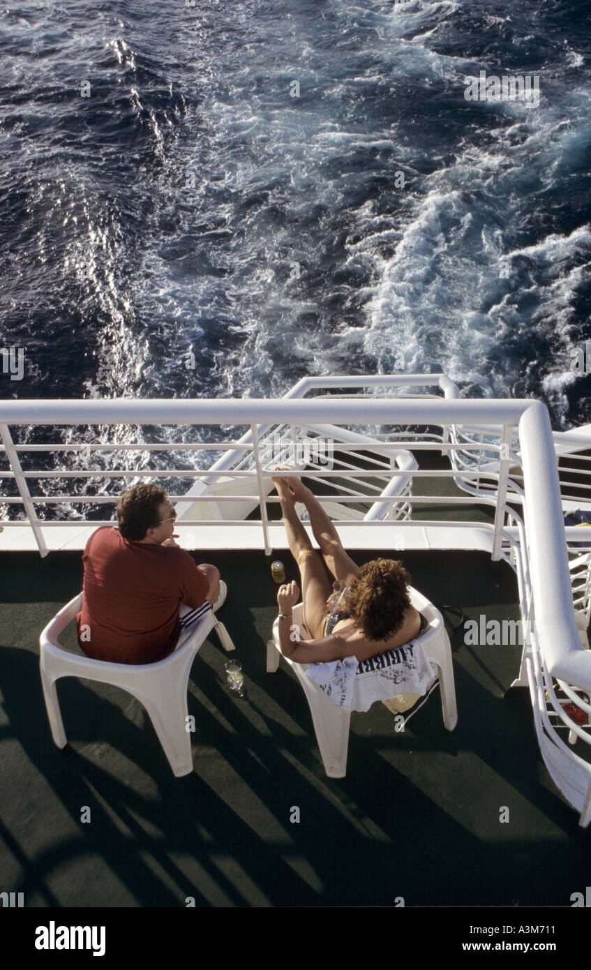Couple relaxing onboard cruise ship Stock Photo