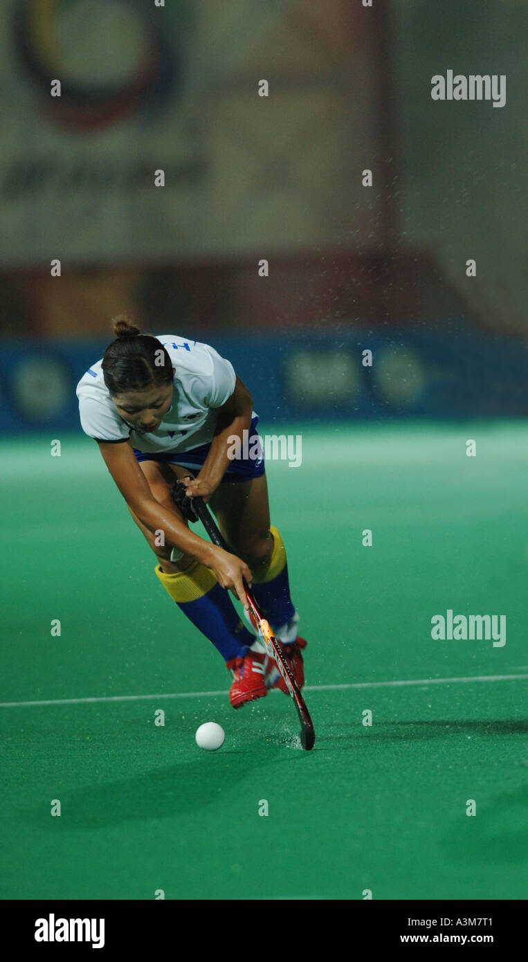 field hockey , player running with ball Stock Photo Alamy