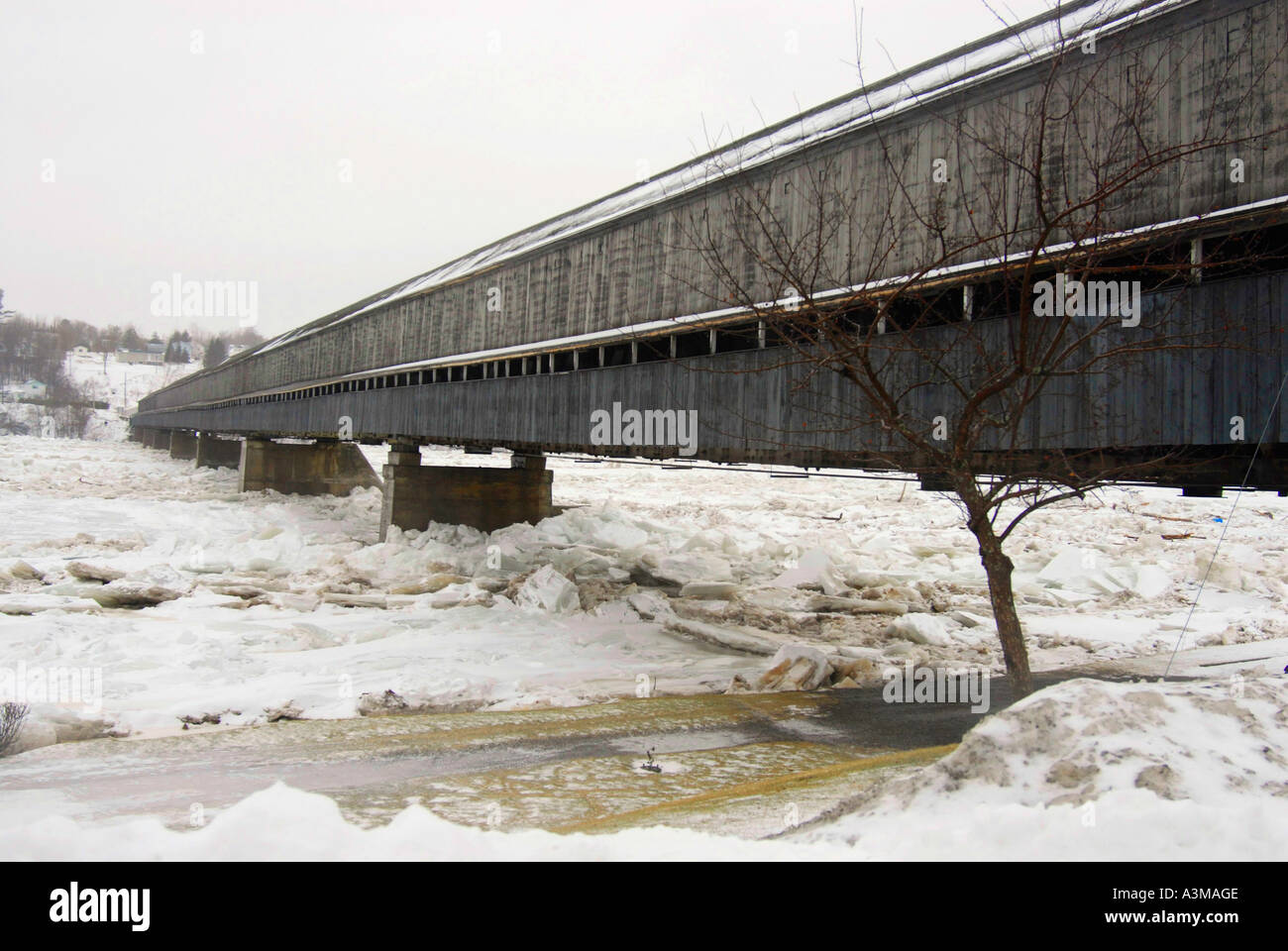Hartland Covered Bridge Hartland New Brunswick Canada with ice jam over the St John River in mid January Stock Photo