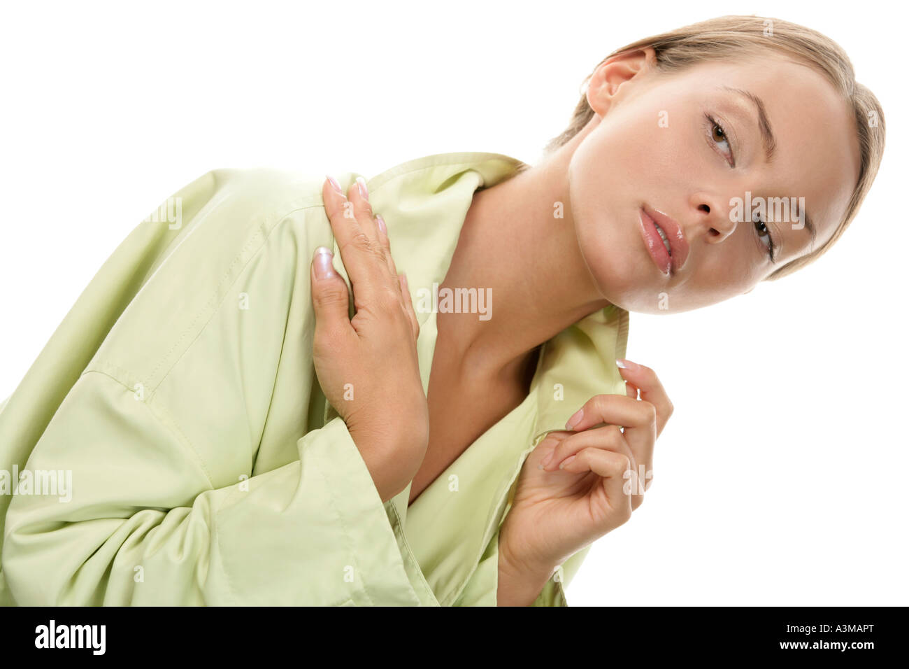 Young woman wearing green coat Stock Photo Alamy