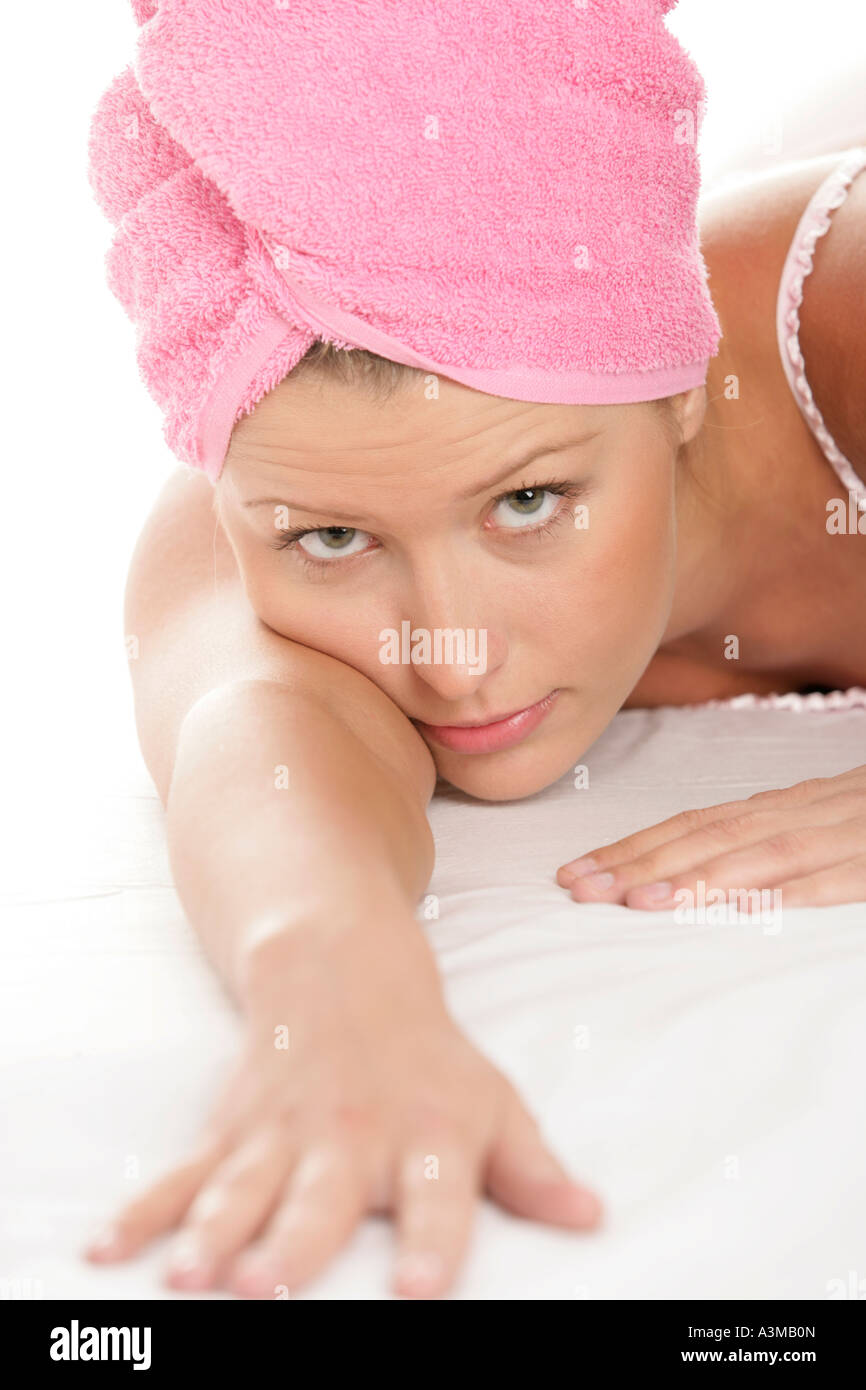 Woman wearing towel around her head Stock Photo